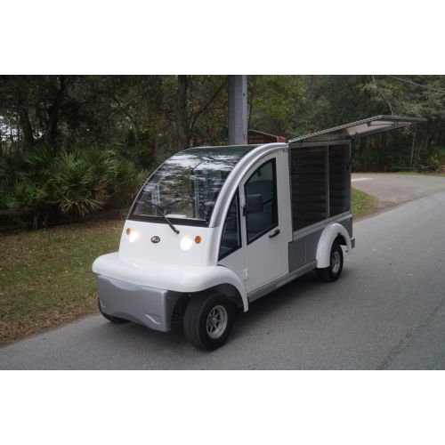 MotoEV Electro Bubble Buddy LSV 2 Passenger Enclosed Utility Deluxe Hard Door white driving